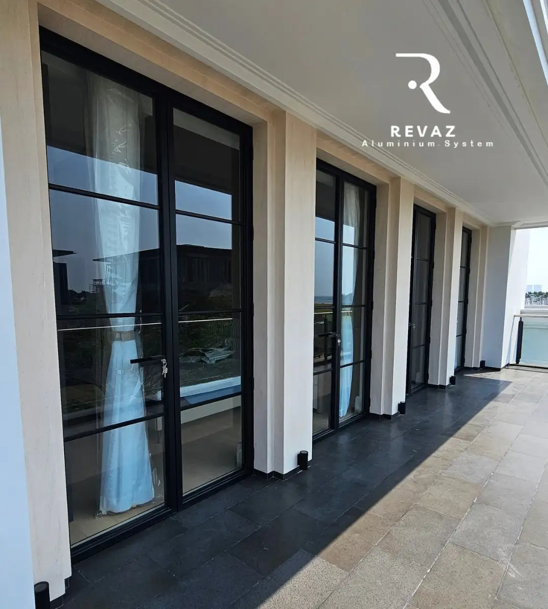 Revaz aluminium doors across a bright terrace